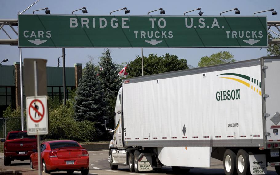 In this Friday June 15, 2012 file photo, Motorists make their way to Ambassador Bridge connecting Canada to the United States in Windsor, Ontario. The U.S. will reopen its land borders to nonessential travel next month, ending a 19-month freeze due to the COVID-19 pandemic as the country moves to require all international visitors to be vaccinated against the coronavirus. The new rules, to be announced Wednesday, Oct. 13, 2021 will allow fully vaccinated foreign nationals to enter the U.S. regardless of the reason for travel (Mark Spowart/The Canadian Press via AP, File)