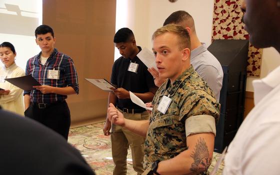 Marine Sgt. Stephen Barbour, a radio operator with the 5th Air Naval Gunfire Liaison Company, speaks to fellow enlisted leaders about suicide prevention at Camp Hansen, Okinawa, Wednesday, Sept. 27, 2023.