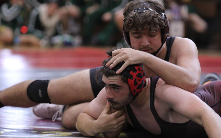 E.J. King's Ashton Wall gets the upper hand on Matthew C. Perry's Maddix Larue at 215 pounds during Saturday's DODEA-Japan wrestling openers. Wall pinned Larue, but the Samurai edged the Cobras 30-29.