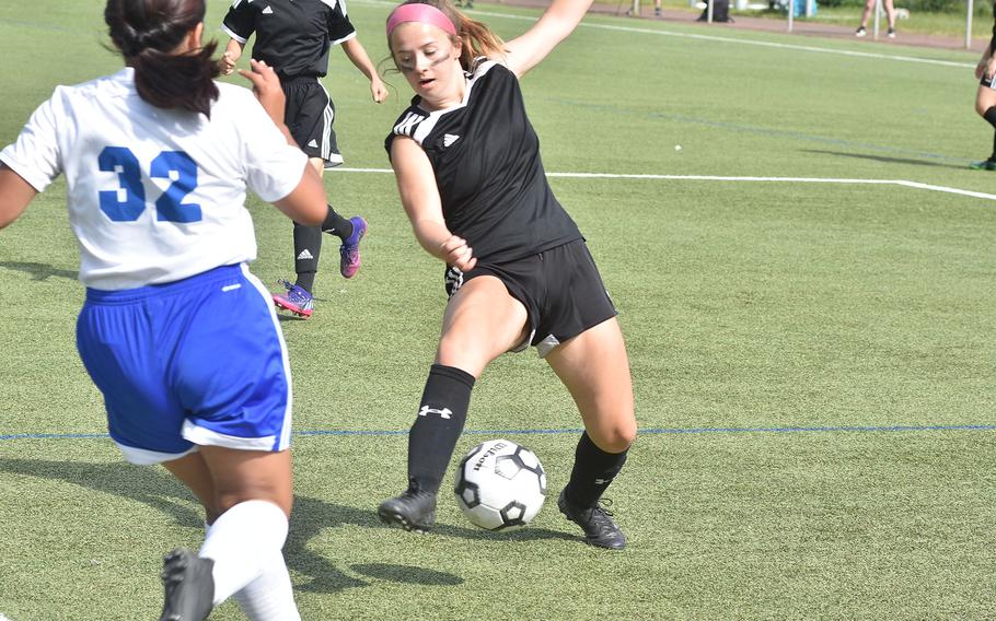Vicenza's Tyler Holt manages to maintain balance in front of the Rota goal while the Admirals' Kim Perez approaches on Tuesday, May 17, 2022, at the DODEA-Europe girls Division II soccer championships at Landstuhl, Germany.