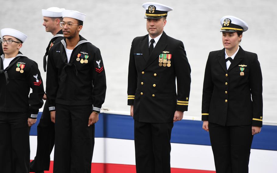 Sailors stand at attention