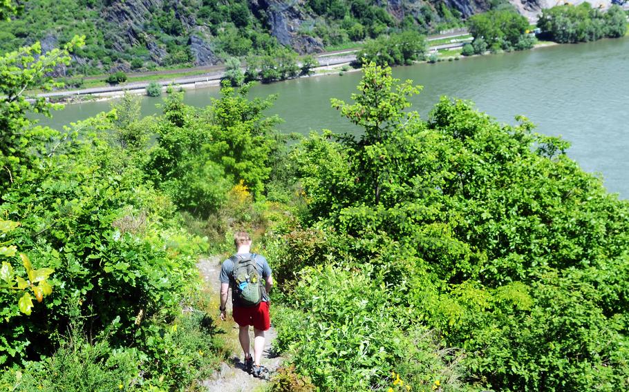 Joshua Seaman, a U.S. soldier based in Wiesbaden, Germany, hikes down part of the RheinBurgenWeg hiking trail near the town of Bad Salzig, June 5, 2021. The trail runs for 120 miles along Germany's longest river, the Rhine, passing scores of castles and other historic buildings along the way.