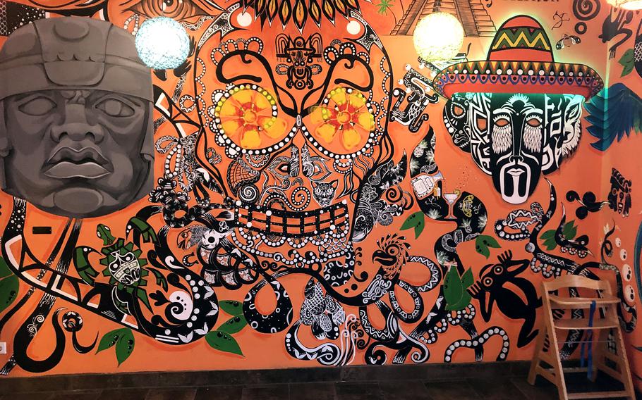 A sugar skull mural painted on the walls of Casa Azteca in Wiesbaden, Germany.