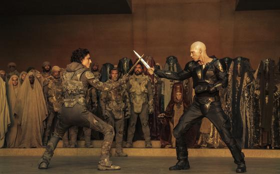 Timothée Chalamet, foreground left, and Austin Butler in a scene from “Dune: Part Two.” The two actors trained, separately, with a Kali instructor in Los Angeles to prepare for their characters’ climactic showdown. 