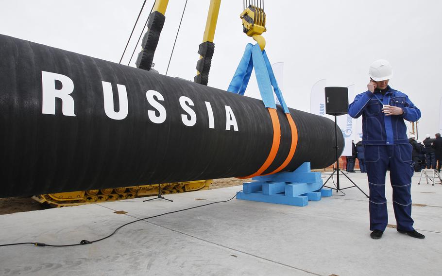 A Russian construction worker attends a ceremony marking the start of Nord Stream pipeline construction in Portovaya Bay some106 miles north-west from St. Petersburg, Russia on April 9, 2010. A new bill introduced in the U.S. Senate on Wednesday, Jan. 12, 2022, would open the door for more penalties related to the Nord Stream 2 project if Russia invades Ukraine.