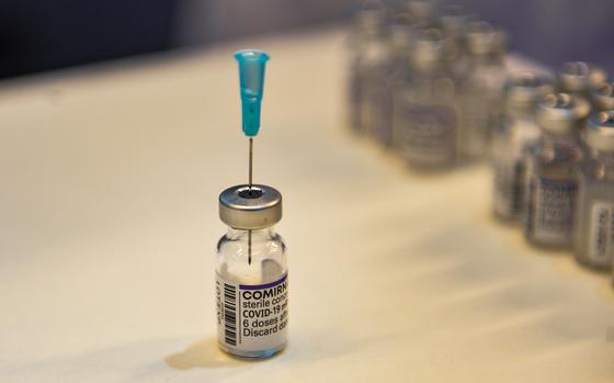 A Comirnaty COVID-19 vaccine bottle during a vaccine drive in Kaiserslautern, Germany, Nov. 30, 2021. New local regulations exempt those who completed their initial vaccination regimen within the last three months to avoid having to test to meet 2G-Plus requirements in Rheinland-Pfalz.