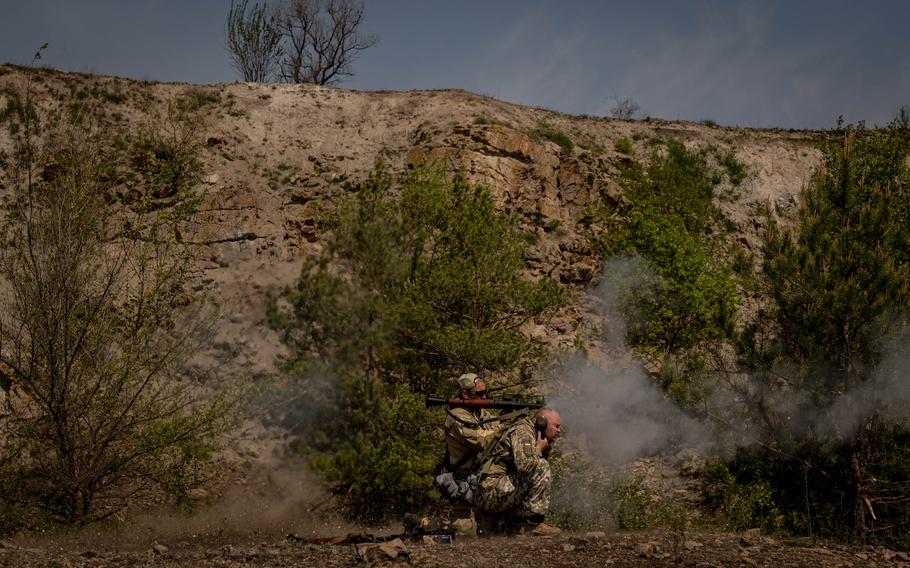 Members of a Zaporizhzhia territorial defense battalion take part in weapons training at a site in the Zaporizhzhia Oblast, Ukraine, on Wednesday, May 11, 2022.