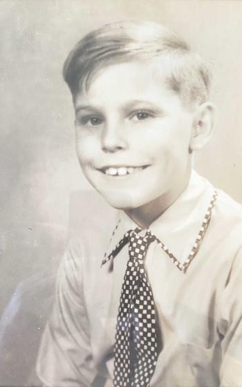 A child smiles for a photo.