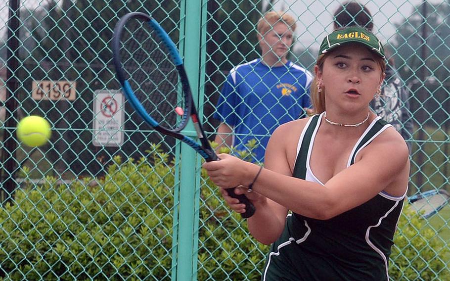 Robert D. Edgren's Caitlyn Carroll strikes a backhand against Yokota's Julia Morioka during Saturday's Japan tennis matches. Carroll won 6-0 and teammed with Jenna Mahoney to win their doubles match 6-1 over Karina and Julia Morioka.