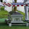 The U.S. Navy Ceremonial Guard holds an American flag over the casket of Starring Brooks Winfield in Arlington National Cemetery on May 9, 2024.