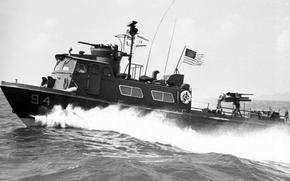 A U.S. Navy fast coastal patrol boat cuts through the Gulf of Thailand during a patrol to prevent the infiltration of Viet Cong and their supplies by sea in March 1968.