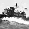 A U.S. Navy fast coastal patrol boat cuts through the Gulf of Thailand during a patrol to prevent the infiltration of Viet Cong and their supplies by sea in March 1968.