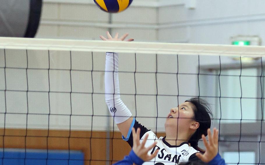Osan's Ashley Kim strikes the ball against Yokota during Tuesday's Far East Division II tournament pool play. The Panthers won in three sets.