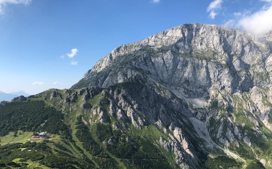 At 1,703-meters, at the border between Germany and Austria, Carl von Stahl Haus, bottom left, shown in this June 27, 2022 photo, is one of the more popular huts in the Berchtesgaden National Park, with bed space for 102 hikers, in both shared bunkrooms or semi-private rooms. 