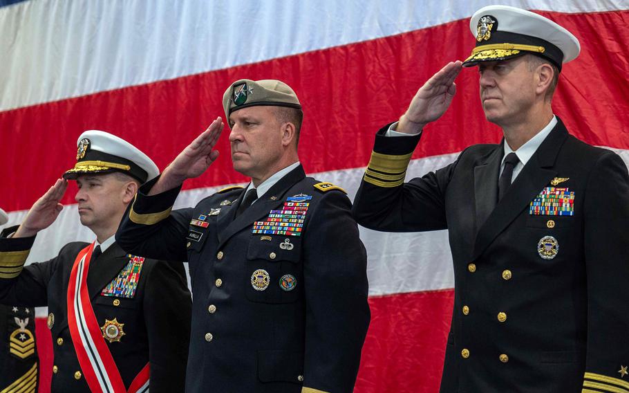 From left, Vice Adm. Brad Cooper, Army Gen. Erik Kurilla and Vice Adm. George Wikoff render honors in Manama, Bahrain, Feb. 1, 2024. Cooper handed command of U.S. Naval Forces Central Command/U.S. 5th Fleet to Wikoff in a ceremony presided over by Kurilla, who leads U.S. Central Command. 