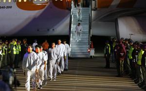 FILE - Venezuelan migrants deported from the United States deplane at the Simon Bolivar International Airport in Maiquetia, Venezuela, Feb. 20, 2025. (AP Photo/Cristian Hernandez, File)