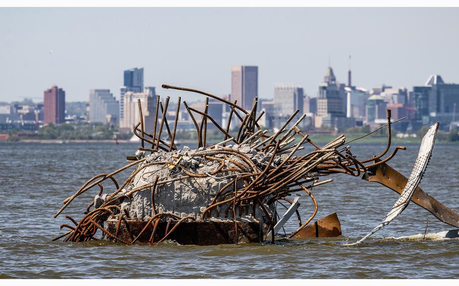 Twisted rebar protrudes from the remains of a support pier of the Francis Scott Key Bridge three weeks after the catastrophic collapse. 