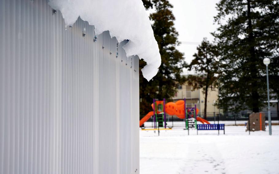 Snow blankets buildings and a playground at the Sagamihara Housing Area near Camp Zama, Japan, Tuesday, Feb. 6, 2024.