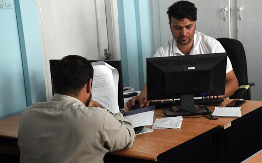 Afghan journalists work in the newsroom of Pajhwok news agency on Sept. 4, 2019. Despite assurances that the Taliban would allow a free media after taking control of the country, rules ban reporting that is contrary to Islam or that insult national figures.