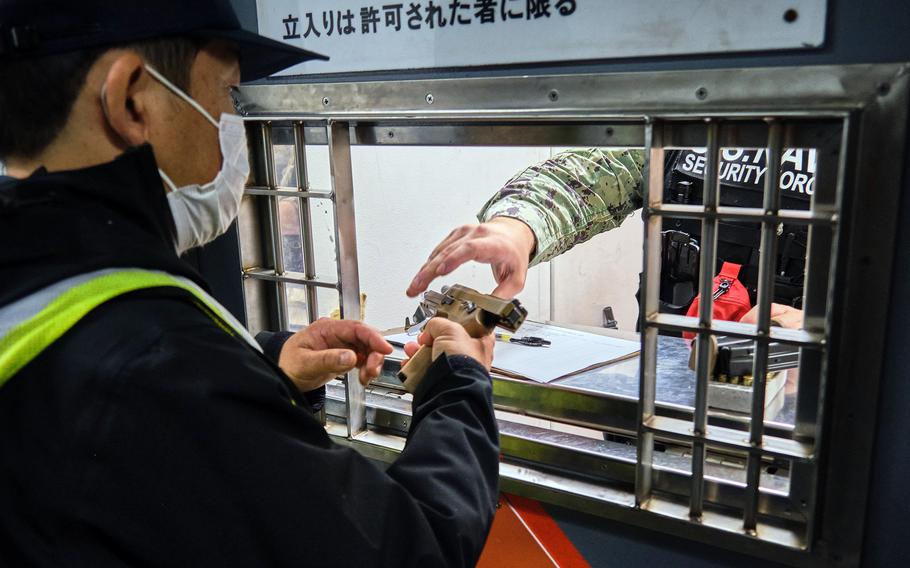 The Navy began issuing new Sig Sauer M18 pistols to security forces personnel at Yokosuka Naval Base, Japan, Friday, Oct. 1, 2021. 