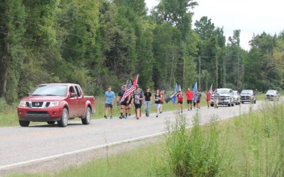 Veterans Robert Hurst and Jarrod Moore are organizing a 21-mile walk on Sept. 11 from Paris to New Blaine, Ark., to remember those who died and to raise awareness about veterans who die by suicide.