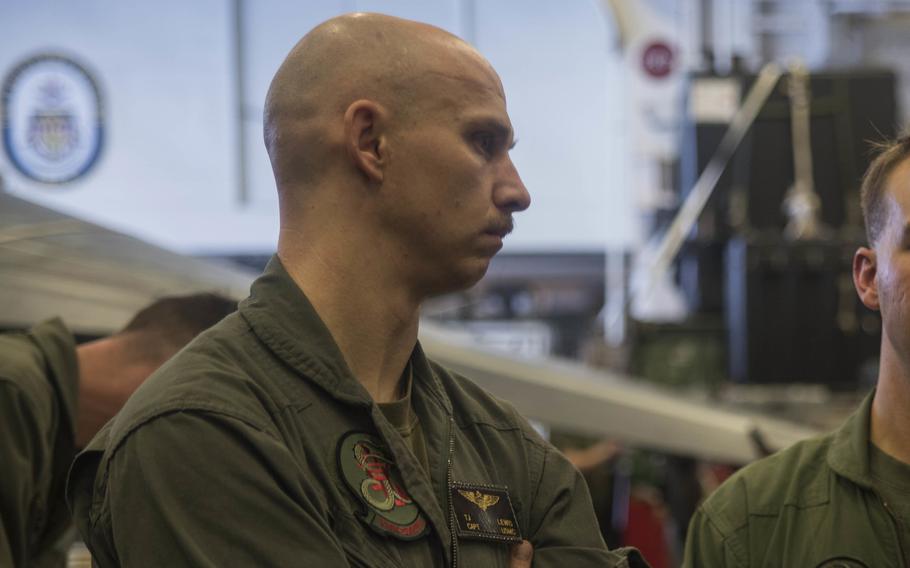 Then-Marine Corps Capt. Tobin Lewis discusses an MV-22 Osprey mishap in the Coral Sea, Aug. 7, 2017. 