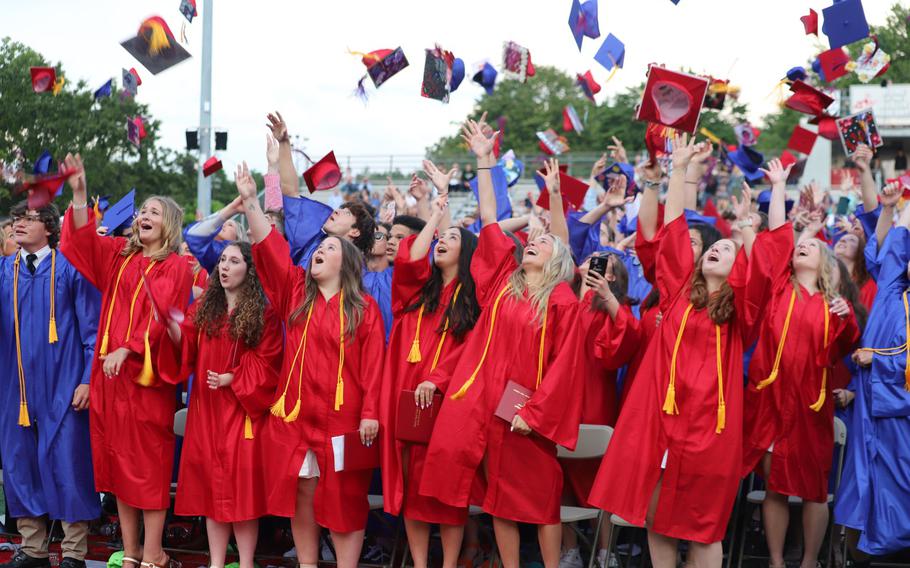 2023 Berlin High School seniors toss their caps at their June 12, 2023, graduation ceremony in Berlin, Conn. Among the class was Navy veteran John Sampl, 99, who enlisted before he could graduate in 1941.