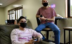 U.S. service members wear masks while relaxing with a video game at Kadena Air Base, Okinawa, Jan. 21, 2022. 