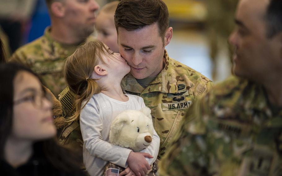 An Idaho Army National Guardsman embraces a family member Feb. 23, 2022, before deploying to support Operation Enduring Freedom.