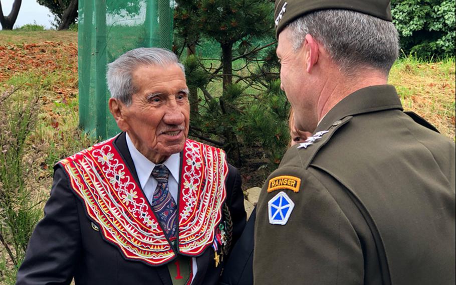 Charles Shay, a veteran of the D-Day landing at Normandy, meets with V Corps commander Lt. Gen. John Kolasheski during a ceremony June 4, 2021, at Omaha Beach. V Corps, which was recently reformed for a new mission in Europe, played a key role in the landing at Omaha Beach 77 years ago. 