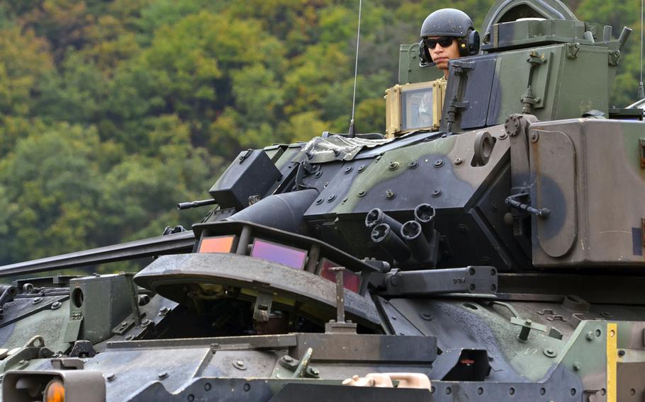 A U.S. soldier surveys the Rodriguez Live Fire Complex from a Bradley fighting vehicle.