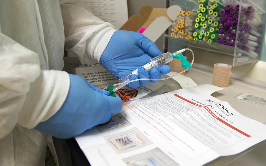 An airman prepares a prenatal testing kit at Joint Base Elmendorf-Richardson, Alaska, Nov. 7, 2017. 