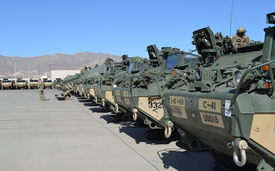 Military vehicles lined up.