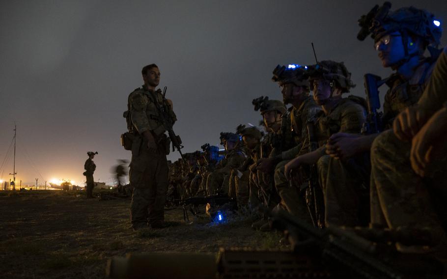U.S. Soldiers, assigned to the 82nd Airborne Division, prepare to board a U.S. Air Force C-17 Globemaster III aircraft in support of the final noncombatant evacuation operation missions at Hamid Karzai International Airport, Afghanistan, Aug. 30, 2021. 