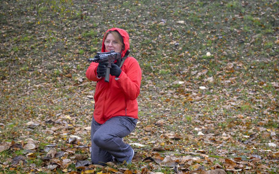 Renata Niedziolka, a 42-year-old accountant from Warsaw, Poland, peers down the barrel of her training rifle as part of a familiarization course at the Military University of Technology in Warsaw, Poland, on Nov. 5, 2022. “I wanted to learn new skills, in case of, you know, an invasion,” said Niedziolka, who has been following news on Russia’s war in Ukraine intensely.