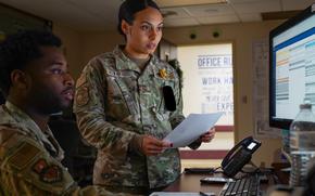 Air Force staff sergeants Destani Alvarado and Michael Wallace examine patient records through Military Healthcare System Genesis at Keesler Air Force Base in Biloxi, Miss., on Jan. 6, 2022. MHS Genesis is the Defense Department's new consolidated medical recordkeeping system.