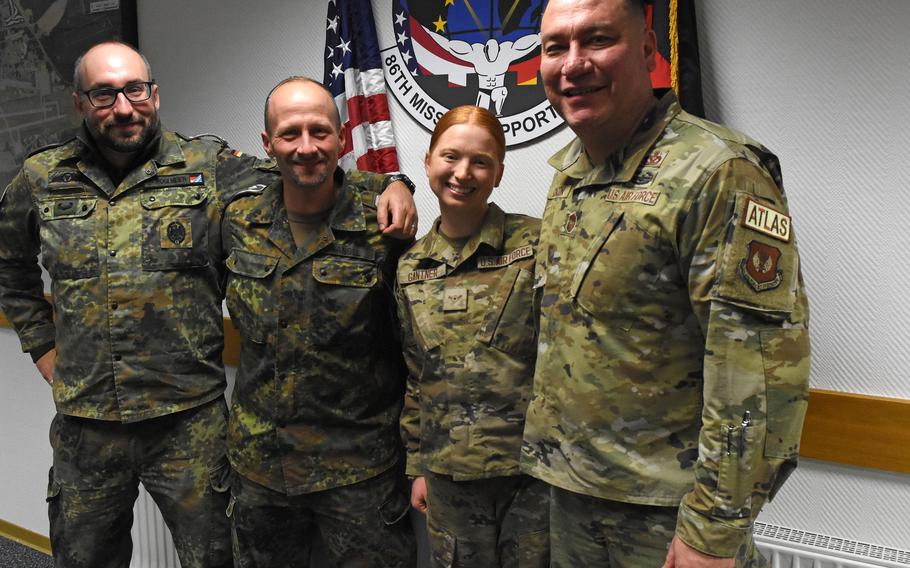 From left, German Master Sgt. Frank Roglmeier and Senior Master Sgt. Benjamin Angel stand with Airman Emma Gantner and Chief Master Sgt. John Chacon, 86th Mission Support Group senior enlisted leader. Gantner recently was the top performer in the German Armed Forces Badge for Military Proficiency held at Ramstein Air Base, Germany.