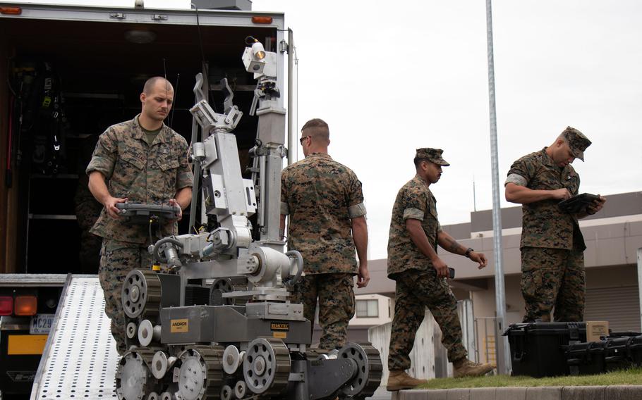 Marines respond to a simulated suspicious package during the annual Active Shield base-defense exercise at Marine Corps Air Station Iwakuni, Japan, Oct. 21, 2021.