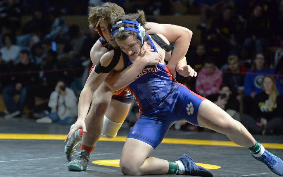 Lakenheath’s Witt Hennig brings down Ramstein’s Colton Lucas on his way to taking the 190-pound title at the DODEA-Europe wrestling championships, in Wiesbaden, Germany, Feb. 11, 2023. 