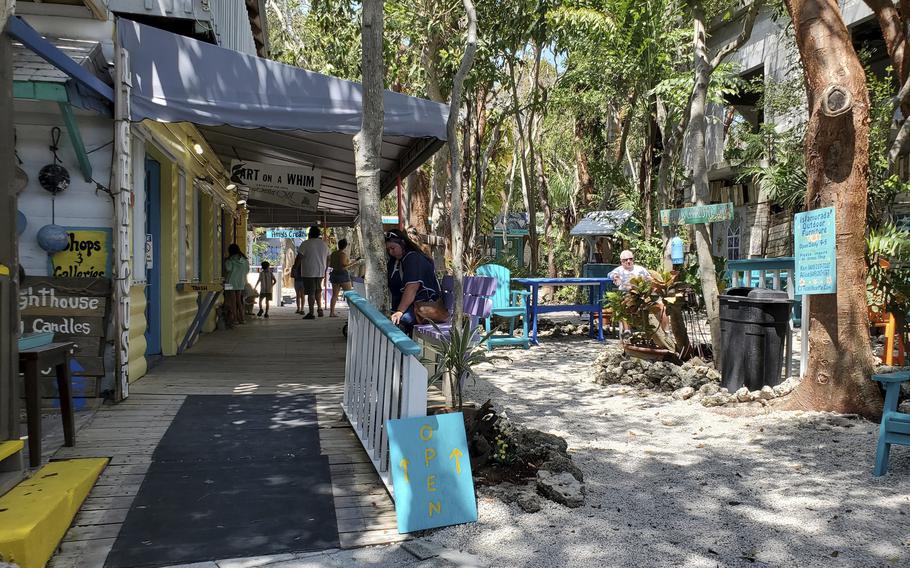 A view of the street and some shops and cafés at Rain Barrel Village in Islamorada, Fla.