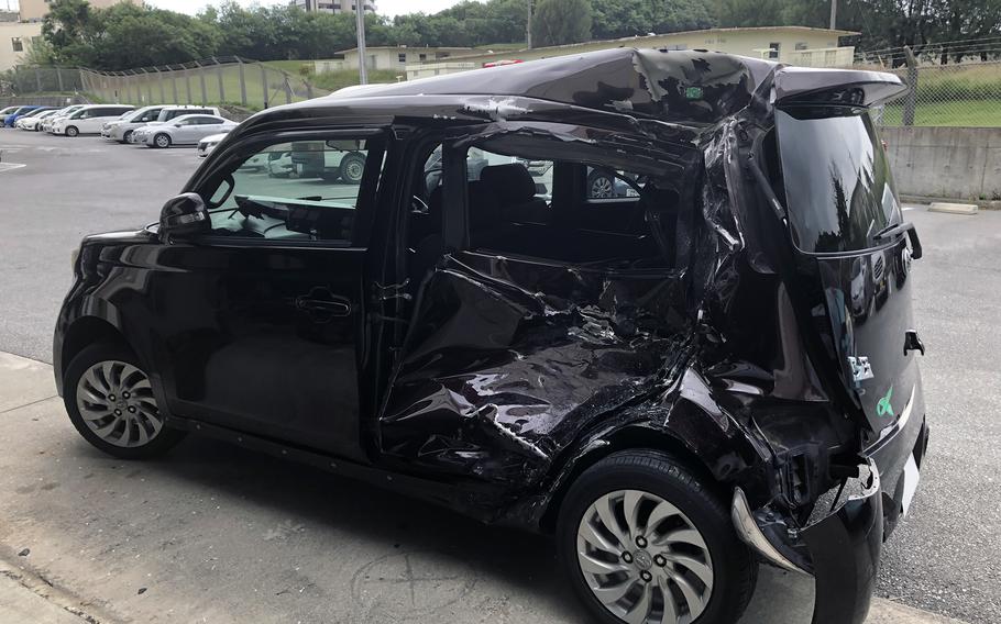 A Toyota bB involved in a fatal collision Nov. 4, 2022, sits outside the Okinawa city police station on Nov. 7, 2022. 