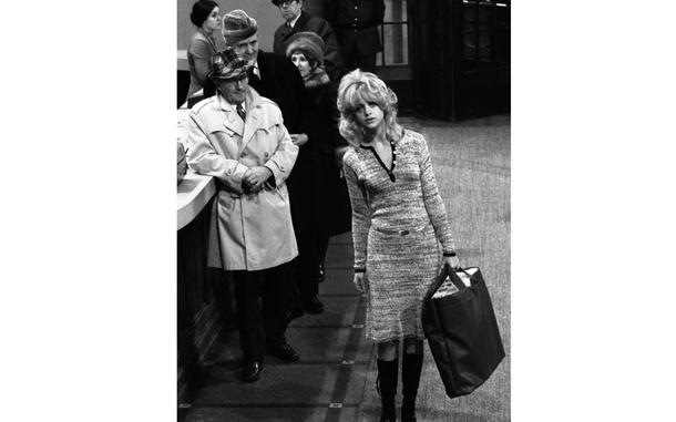 Hed: Actress Goldie Hawn during the filming of "$", 1971

Hamburg, Germany, February 11, 1971:  Extras playing bank customers during the filming of "$" at Hamburg's art museum ogle co-star Goldie Hawn as she walks through the "United World Bank" interior built at the museum by Columbia Pictures. Hawn, although a relative newcomer to movies after gaining popularity on the "Laugh-In" TV comedy series, had already won an Oscar for her role in "Cactus Flower" the year before.

META TAGS: Entertainment; movie set; actor; actress; celebrity; 