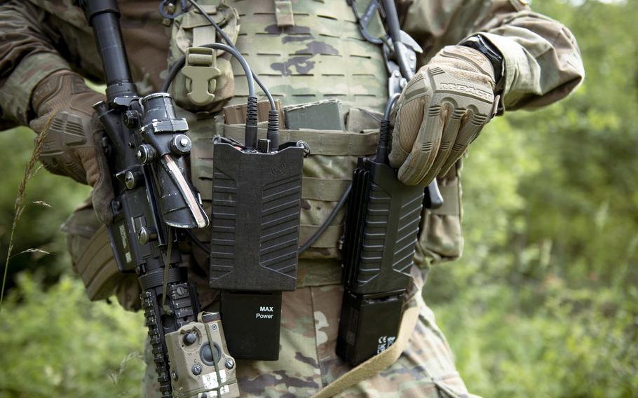 A uniformed troop wears a utility belt.