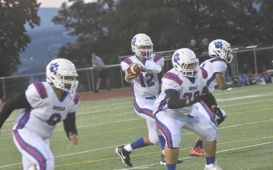 Ramstein quarterback CJ Delp gets set to pass against the Wiebaden Warriors during a football game held Friday, Sept. 17, 2021, in Wiebaden