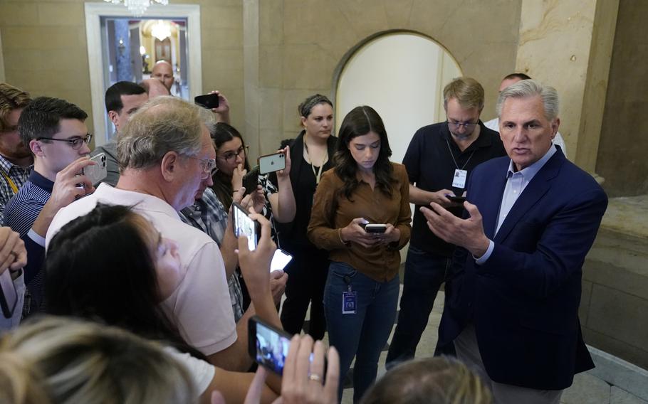 Speaker of the House Kevin McCarthy, R-Calif., speaks with members of the press after participating in a phone call on the debt ceiling with President Joe Biden, Sunday, May 21, 2023, on Capitol Hill in Washington.
