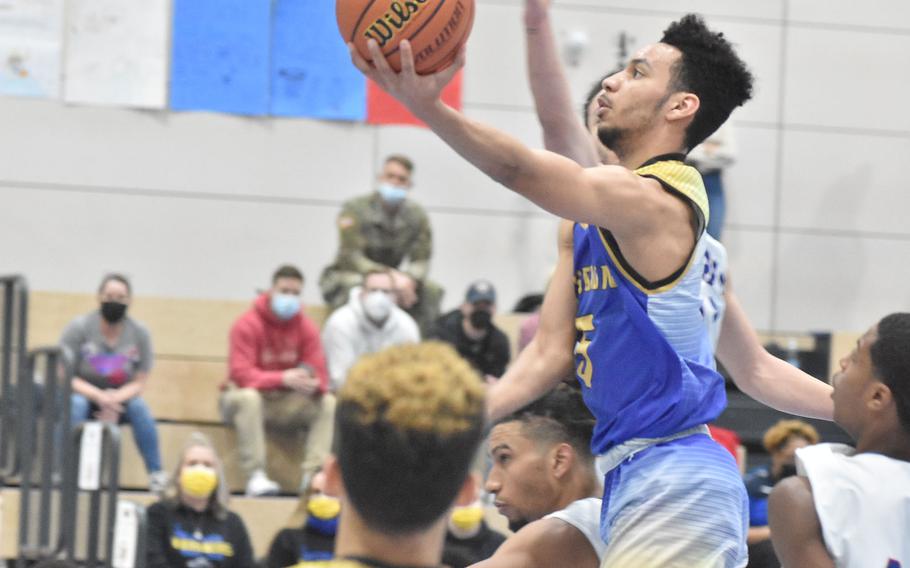 Wiesbaden's Kaleb McKenzie sails toward the basket against Stuttgart on Friday, Feb. 25, 2022, at the DODEA-Europe Division I basketball championships.