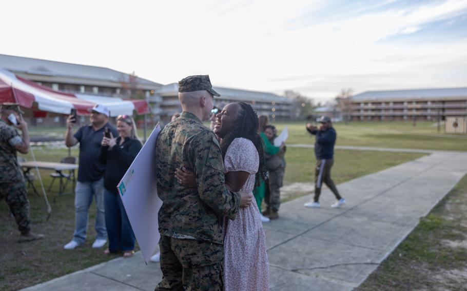 A U.S. Marine with Combat Logistics Battalion 22, 26th Marine Expeditionary Unit (Special Operations Capable) reunites with his wife after returning from deployment to Camp Lejeune, N.C., Monday, March 18, 2024.