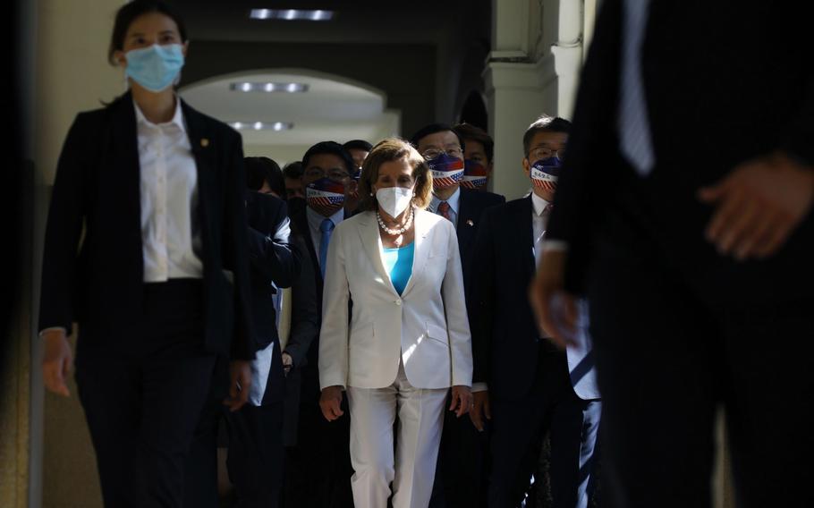 U.S. House Speaker Nancy Pelosi, center, arrives at the Legislative Yuan in Taipei, Taiwan, on Wednesday, Aug. 3, 2022. 