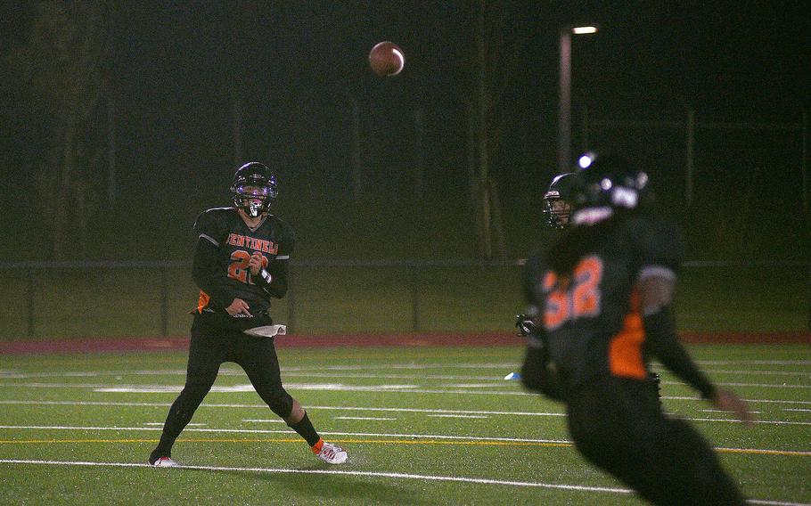 Sentinel quarterback Casey Supinger throws a pass to teammate Messiah Smith during the DODEA-Europe Division III championship game on Oct. 29, 2023, at Spangdahlem High School in Spangdahlem, Germany. The Sentinels won, 44-6, for their first title since 2019.