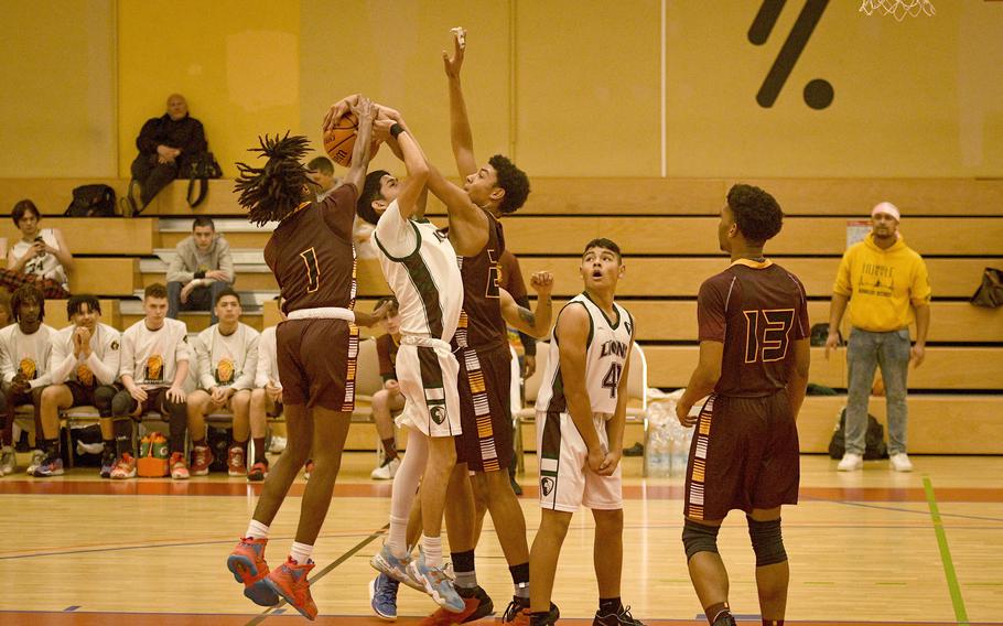 Baumholder’s Leo Kirkland and Damian Jung team up for a block during a DODEA-Europe Division III basketball semifinal game Feb. 17, 2023, in Baumholder, Germany.